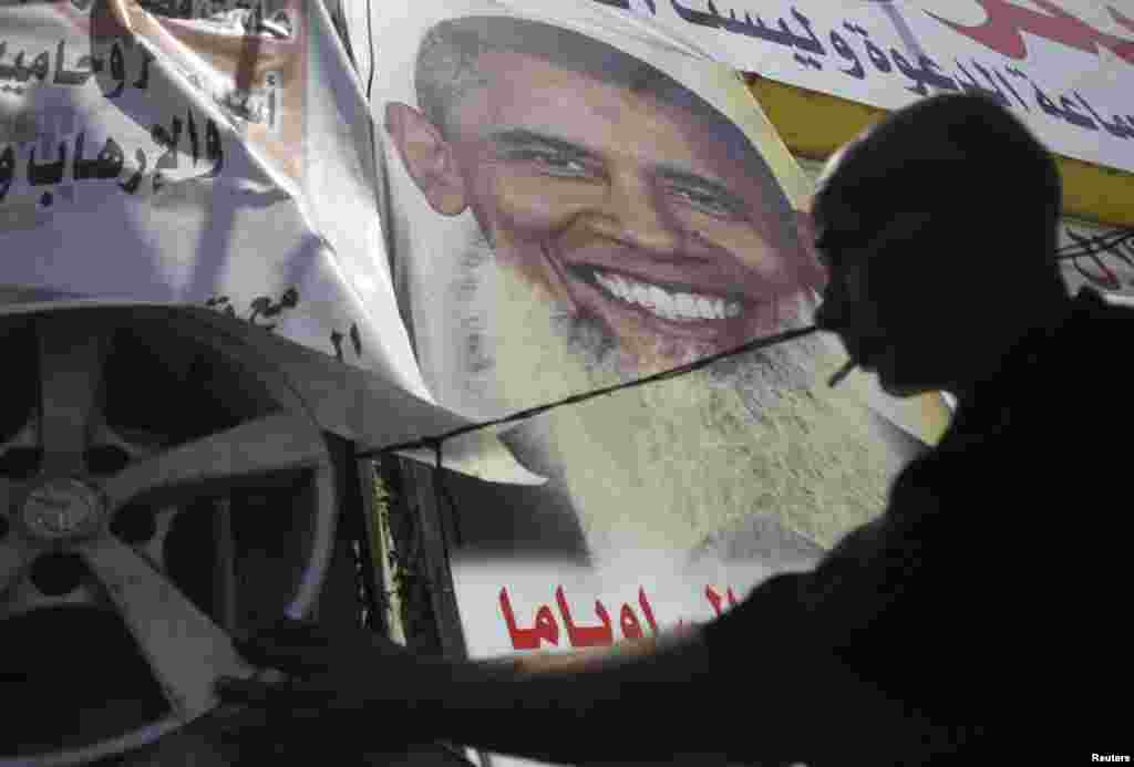 Qohirada AQSh prezidenti Barak Obamaning suratini ko&#39;rasiz.
