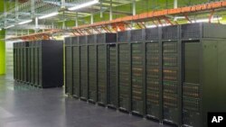 IT specialist Danny Rotscher checks the operating system of the High Performance Computing and Storage Complex II (HRSK-II) during the official opening of the new data center of the Lehmann Center (LZR) of the Dresden University of Technology in Dresden, 