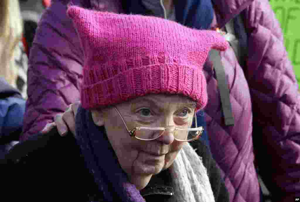A woman wearing a pink cap marches in a women's march that brought tens of thousands to Seattle, Jan. 21, 2017. Women across the Pacific Northwest marched in solidarity with the Women's March on Washington and to send a message in support of women's right