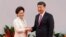 Hong Kong Chief Executive Carrie Lam shakes hands with Chinese President Xi Jinping after she swore an oath of office on the 20th anniversary of the city's handover from British to Chinese rule, in Hong Kong, China, July 1, 2017.