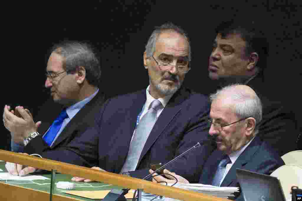 Syria's United Nations Ambassador Bashar Ja'afari waits on the bench before Deputy Prime Minister Walid Al-Moualem addresses the 69th session of the U.N. General Assembly at U.N. headquarters, Sept. 29, 2014.