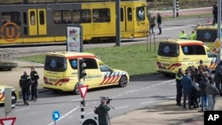 Ambulances are seen next to a tram after a shooting in Utrecht, Netherlands, March 18, 2019. 
