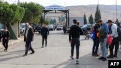 Syrians return to Damascus via Lebanon's Masnaa border crossing east of Beirut on Dec. 8, 2024, following the fall of the Syrian capital to anti-government fighters.