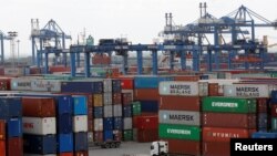 Containers are loaded at a port in Ho Chi Minh City, Vietnam July 27, 2018. 