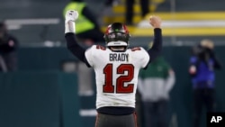 Tampa Bay Buccaneers quarterback Tom Brady reacts after winning the NFC championship NFL football game against the Green Bay Packers in Green Bay, Wis., Jan. 24, 2021.