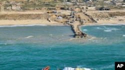 Sur cette photo fournie par l'armée israélienne, l'aide humanitaire transportée par un navire de l'organisation World Central Kitchen, arrive dans l'espace maritime de la bande de Gaza, le 15 mars 2024. 