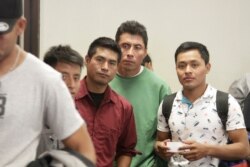 Asylum-seekers from Guatemala board a Greyhound bus in El Paso, Texas, April 2, 2019. They say they spent four days sleeping on rocks under a bridge in a detention area that U.S. immigration officials have since dismantled.