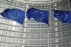EU flags fly outside the European Commission in Brussels