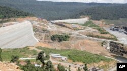 This Oct. 6, 2012 photo shows a construction site of a dam being built by China National Heavy Machinery Corporation on the Tatay River in Koh Kong province, some 210 kilometers (130 miles) west of Phnom Penh, Cambodia. 