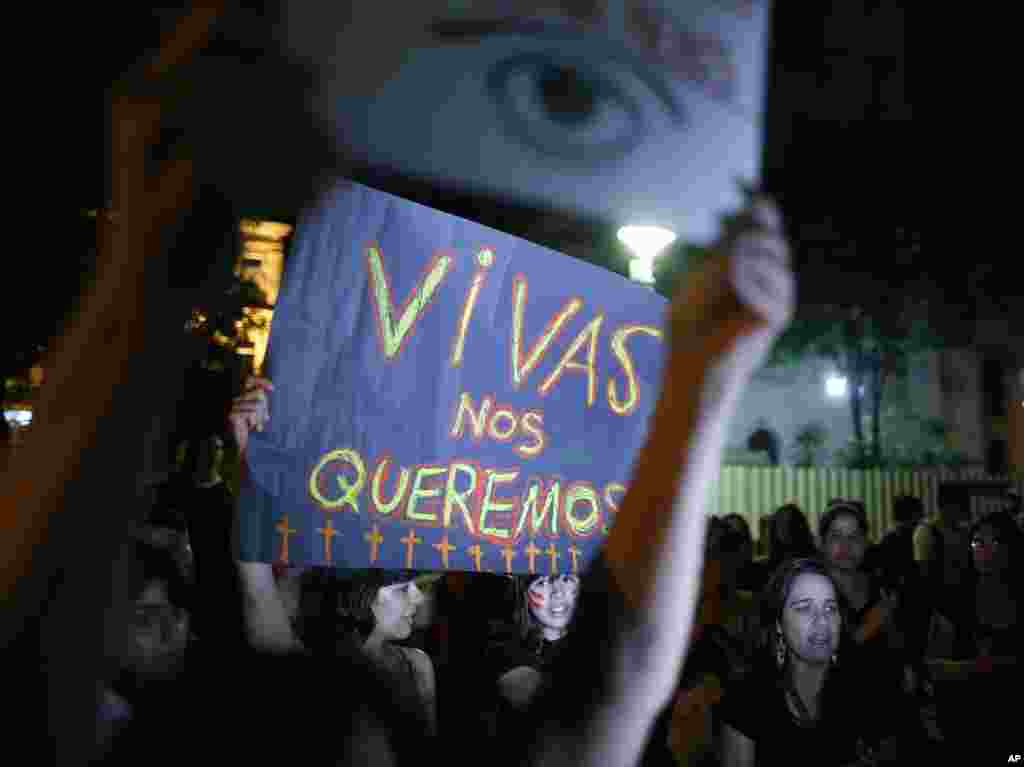 Women hold a sign that reads in Spanish "We want ourselves alive" during a protest against gender violence in Asuncion, Paraguay, Oct. 19, 2016. Similar protests were made throughout Latin America.
