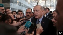 Turkey's President Recep Tayyip Erdogan speaks to the media in Ankara, Turkey, Jan. 8, 2019. 