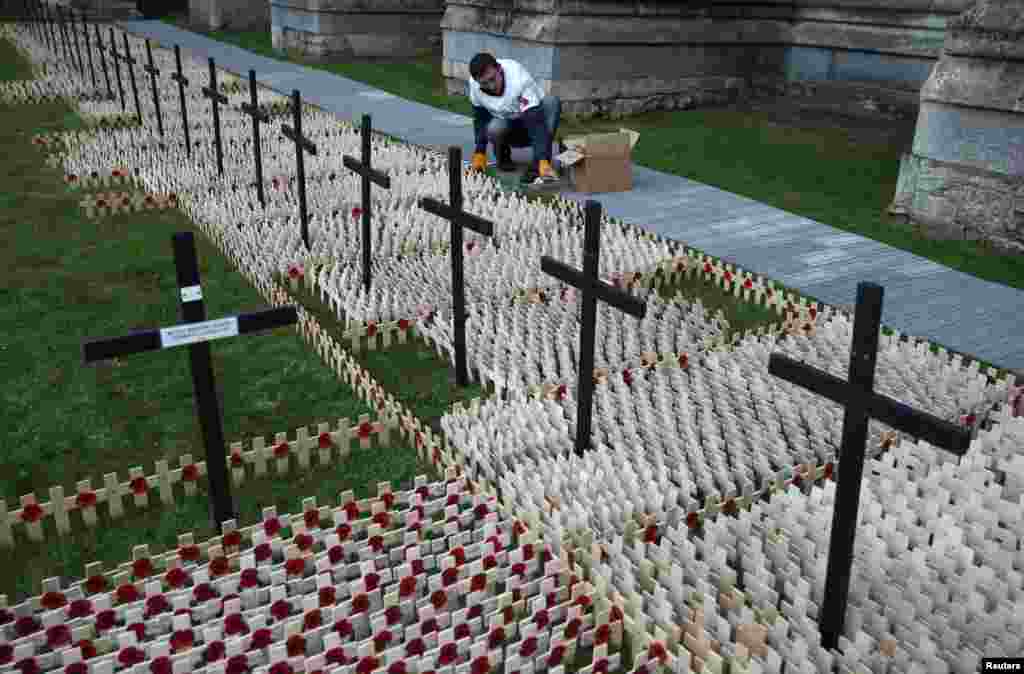 Poppies on wooden crosses are installed at the Field of Remembrance at St. Margaret's Church in Westminster, London.
