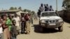 FILE - Zambian police patrol near the Chawama Compound in Lusaka, where residents had attacked and looted foreign-run shops, April 19, 2016. Political campaigning in Lusaka was suspended because of violent clashes ahead of next month’s national elections.
