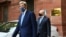 U.S. climate envoy John Kerry, left, leaves the Ministry of Finance after a meeting with Indian Finance Minister Nirmala Sitharaman in New Delhi, April 6, 2021.