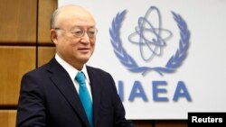 FILE - International Atomic Energy Agency (IAEA) Director General Yukiya Amano arrives for a board of governors meeting at the IAEA headquarters in Vienna, Nov. 20, 2014. 