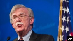 Penasihat Keamanan Nasional AS John Bolton saat memaparkan strategi Pemerintahan Trump di Afrika, dalam acara di Heritage Foundation di Washington, 13 Desember 2018.
