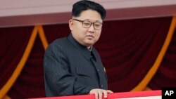 FILE - North Korea's leader Kim Jong Un watches a parade in Pyongyang, May 10, 2016. 