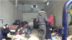 Families trying to cross into Europe camp at this gas station near the Turkish border with Greece, March 18, 2020. (Heather Murdock/VOA)