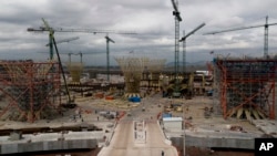 FILE - Construction work is seen on a new airport in Texcoco, Mexico, Oct. 17, 2018.