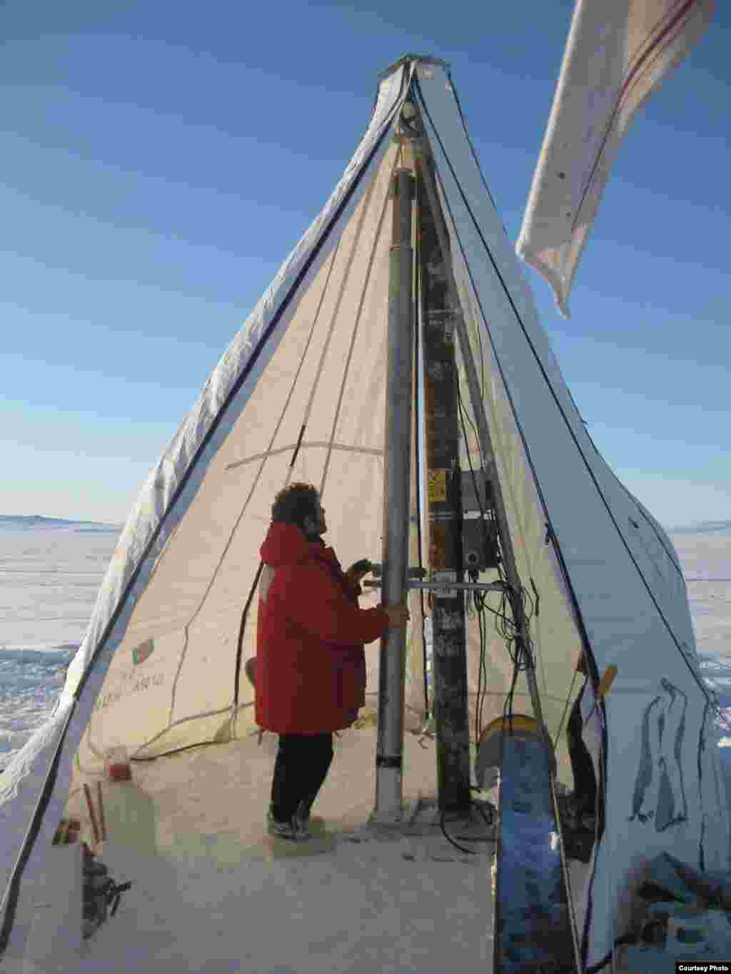 A lightweight ice core drill is used to penetrate to within a few meters of the ocean. The coring drill is then replaced with a small thermal melting drill for the last few meters into the ocean. (David Holland) 