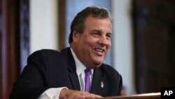 New Jersey Gov. Chris Christie laughs at a question from the media after speaking in Trenton, N.J. Donald Trump is pledging that the government he appoints will bring sweeping change to Washington’s culture, Aug. 29, 2016 file photo.
