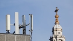 FILE - Mobile network phone masts are visible in front of St Paul's Cathedral in London, Jan. 28, 2020. Britain is among countries that, because of security concerns, have begun removing Huawei equipment that already had been installed.