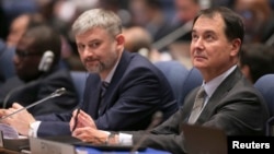 Members of the Russian delegation listen to proceedings at the International Civil Aviation Organization's (ICAO) global safety meeting in Montreal, Feb. 3, 2015. 