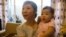  Tran Trinh is an educated and well-off woman, but she had hoped her daughter Minh would turn out to be a son. (VOA - L. Hoang)