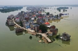 Banjir di sekitar Danau Poyang yang dipicu hujan lebat di daerah Poyang, kota Shangrao, provinsi Jiangxi tengah, China, 15 Juli 2020. (Foto: dok).