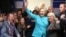 U.S. Democratic presidential nominee Hillary Clinton greets people at a campaign office in Seattle, Washington, Oct. 14, 2016. 