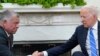 President Joe Biden, right, shakes hands with Jordan's King Abdullah II in the Oval Office of the White House in Washington, July 19, 2021.