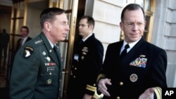 Navy Adm. Mike Mullen, chairman of the Joint Chiefs of Staff (right) is welcomed to the 3rd Annual U.S. Central Command Chiefs of Defense Conference by U.S. Army Gen. David Petraeus, commander, USCENTCOM at the Fairfax Hotel, Washington, D.C., 25 Jan 2010
