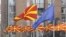 FILE - Macedonian and European flags fly side by side in Macedonia's capital Skopje, March 15, 2012.
