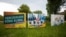 FILE - Election campaign posters from Germany's Green party and Christian Democratic Union party stand near a road in the federal state Saxony-Anhalt's capital Magdeburg, Germany, June 2, 2021.