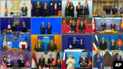 FILE - This image from a teleconference provided by the Vietnam News Agency shows the leaders and trade ministers of 15 Regional Comprehensive Economic Partnership countries in a virtual group photo in Hanoi, Vietnam, Nov. 15, 2020.