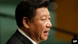 President Donald Trump hands out canned goods and other supplies at Calvary Chapel, Oct. 3, 2017, in Guaynabo, Puerto Rico. 