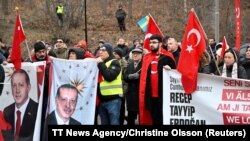 Members of pro-Turkish organization Union of European Turkish Democrats (UETD) demonstrate in support of Turkey and President Recep Tayyip Erdogan outside the Turkish embassy in Stockholm, Sweden, Jan. 21, 2023. 
