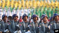 FILE - Police march during a ceremony marking Myanmar's 75th anniversary of Independence Day in Naypyitaw, Myanmar, Jan. 4, 2023. 