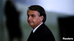 Presiden Brazil Jair Bolsonaro, saat masih menjabat, menghadiri upacara di Istana Planalto, Brasilia, Brazil, 20 Juni 2022. (Foto: Ueslei Marcelino/Reuters)
