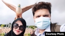 Syed Fawad Ali Shah is pictured with his wife in Langkawi, Malaysia, in early 2022.