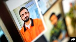 A recent photograph of Abdul Wasi Safi is shown as his brother, Sami-ullah Safi, talks about his brother's journey to the U.S. during an interview, Jan. 18, 2023, in Houston. Wasi Safi was an intelligence officer with the Afghan National Security Forces.