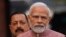 FILE - Indian Prime Minister Narendra Modi, center, addresses the media on the opening day of the winter session of the Parliament, in New Delhi, India, Dec. 7, 2022. 