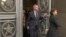 In this handout photo taken from video released by Russian Foreign Ministry Press Service, Estonian Ambassador to the Russian Federation Margus Laidre leaves the Russian Foreign Ministry's building in Moscow, Jan. 23, 2023. 