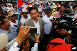 Thach Setha, now vice president of the country's main opposition Candlelight Party talks to media members near the Vietnam Embassy in Phnom Penh on August 14, 2014. (Heng Sinith/AP)