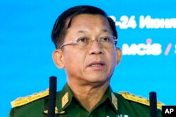 FILE - Commander-in-Chief of Myanmar's armed forces, Senior Gen. Min Aung Hlaing delivers his speech at the IX Moscow conference on international security in Moscow, Russia, June 23, 2021.