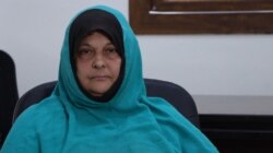 Merika Boudouaia, 50, a French widow who traveled with her husband to Syria in 2014, says she deeply regrets bringing her children to Syria on Oct. 19, 2021, in al-Roj camp, Syria. (Ali Zeyno/VOA)