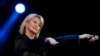 FILE - Singer Olivia Newton-John performs at the 58th Vina del Mar International Song Festival in Vina del Mar, Chile, Feb. 23, 2017.