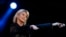 FILE - Singer Olivia Newton-John performs at the 58th Vina del Mar International Song Festival in Vina del Mar, Chile, Feb. 23, 2017.
