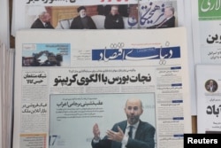 FILE - A newspaper with a cover picture of U.S. Special Representative for Iran Robert Malley is seen in Tehran, Iran, Nov. 29, 2021. (Majid Asgaripour/WANA via Reuters)