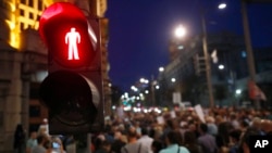 FILE - Journalists gather during a protest by the Group for Media Freedom in front of the government headquarters in Belgrade, Serbia, Oct. 16, 2019. Group for Media Freedom says journalists endure daily insults, pressures, vilifications and threats.